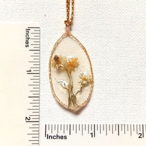 Floral necklace, amulet